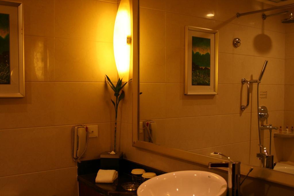 Merryland Traders Hotel Changshu Quarto foto
