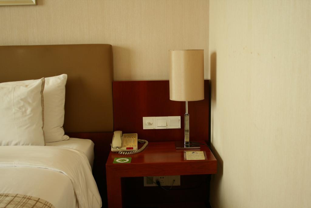 Merryland Traders Hotel Changshu Quarto foto