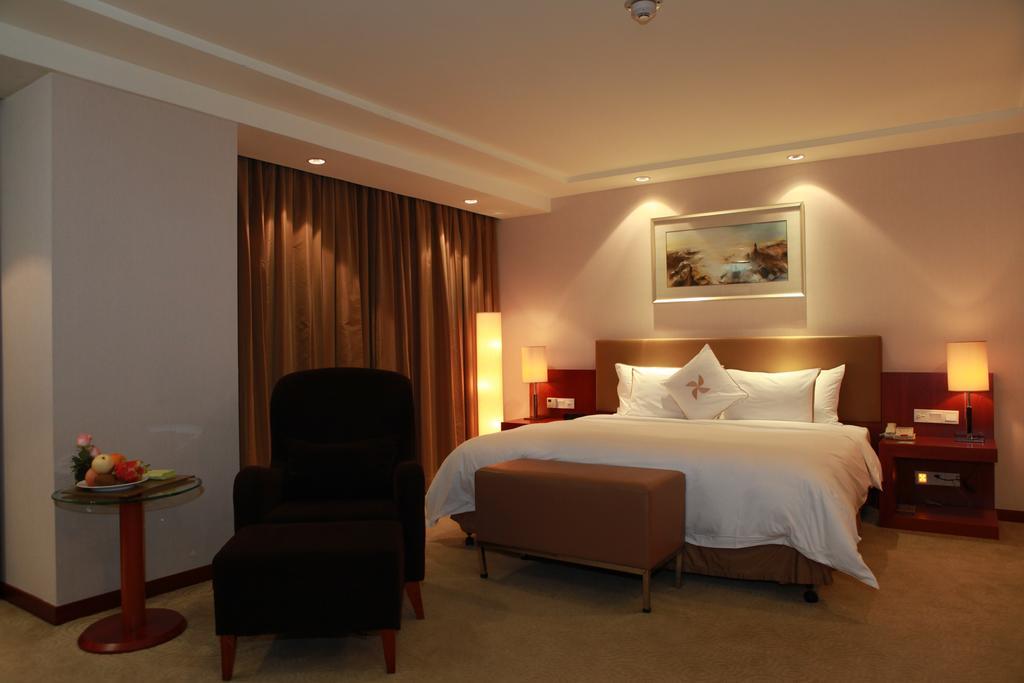 Merryland Traders Hotel Changshu Quarto foto