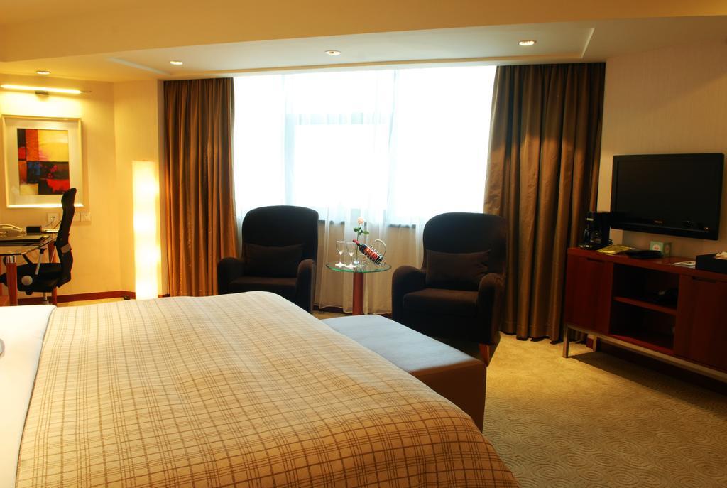 Merryland Traders Hotel Changshu Quarto foto